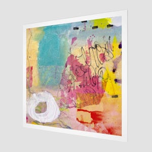 May include: Abstract art print with a white border. The artwork features a mix of colors, including blue, yellow, pink, and red. A white circle and black scribbles are also present. The piece has a textured appearance.