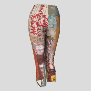 May include: Capri-length leggings with a patchwork design. The leggings feature a collage of textures, including what appears to be handwritten text, red paint strokes, and various paper elements. The color palette includes shades of beige, brown, red, and blue.