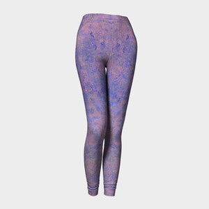 May include: Purple and pink patterned leggings with a marbled design.