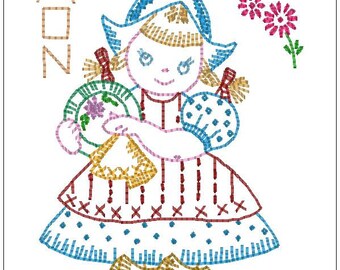 May include: A colorful embroidered illustration of a girl wearing a blue and white hat and dress, holding a basket of flowers. The word "MON" is embroidered in the top left corner of the image.