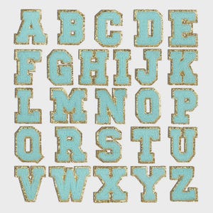 May include: A collection of turquoise chenille letter patches with gold glitter borders. Each letter of the alphabet is displayed, showcasing a classic varsity style. The patches are arranged on a light gray background.