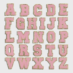 May include: A full alphabet of pink, fuzzy, embroidered patches with gold trim. Each letter is a different shape and size, with a classic collegiate font. The patches are arranged in rows and columns against a white background.