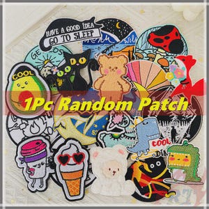 May include: A selection of embroidered patches with diverse designs, such as an avocado, a black cat, a teddy bear, and an ice cream cone. Some patches include text like "COOL" and "HAVE A GOOD IDEA GO TO SLEEP".
