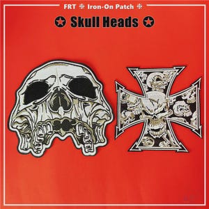 May include: Two iron-on patches with skull designs on a red background. One patch is a detailed skull, the other is a cross shape with skull imagery. The text "Skull Heads" is above the patches.