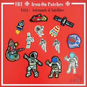 May include: A selection of iron-on patches with a space theme, including rockets, astronauts, and satellites. The patches are in various colours, such as blue, red, and white, and feature the text "FRT Iron-On Patches NASA - Astronauts & Satellites" on a red background.