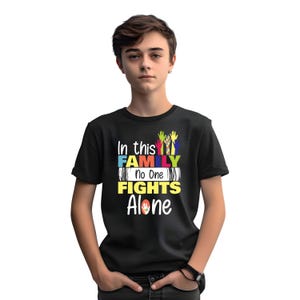 In This Family No One Fight Alone T-Shirt, Funny Colorful Puzzle Piece Graphic Shirt, Adult Kids Unisex Gift Tee Top
