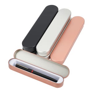 May include: Three metal pen cases in black, silver, and rose gold. One case is open, revealing a black pen inside.