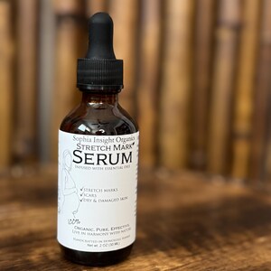 May include: A brown glass bottle of Sophia Insight Organics Stretch Mark Serum with a black dropper. The label lists ingredients and benefits for stretch marks, scars, and dry skin. The bottle contains 2 fl oz (30 ml) of serum.