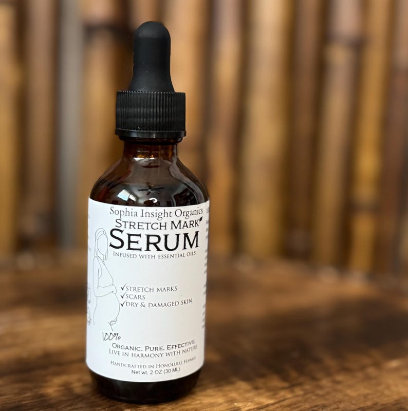 May include: A brown glass bottle of Sophia Insight Organics Stretch Mark Serum with a black dropper. The label lists ingredients and benefits for stretch marks, scars, and dry skin. The bottle contains 2 fl oz (30 ml) of serum.