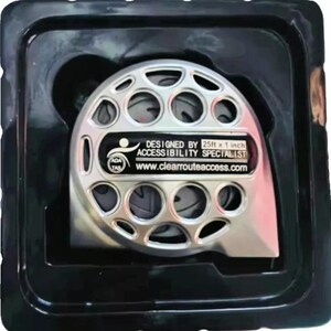 May include: A silver-colored measuring device with multiple circular openings, packaged in a black plastic container. The device has a label that reads "DESIGNED BY 25ft x 1 inch ACCESSIBILITY SPECIALIST www.clearrouteaccess.com".