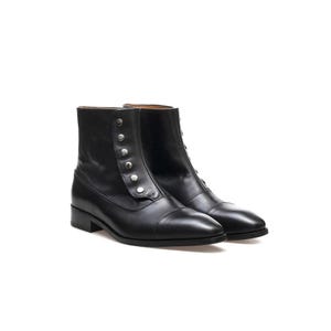 May include: A pair of black leather ankle boots with a button-up closure. The boots have a rounded toe and a low heel. The boots are approximately 15 cm tall.