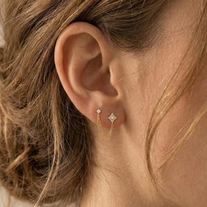Pendiente de plata de ley con circonita en forma de estrella y doble cadena