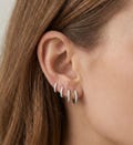 925 Sterling Silver Moissanite Huggie Hoop Earrings | Dainty Jewelry | Hypoallergenic Versatile Gift for Women product logo