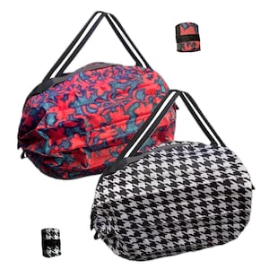 May include: Two foldable shopping bags. One bag is red with a floral pattern and the other is black and white with a houndstooth pattern.