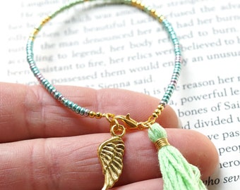 ON VACATION, Light Green Tassel Bracelet Thin Gold Beaded Bracelet Angel Wing Charm Boho Friendship Bracelet Tiny Seed Bead Minimal