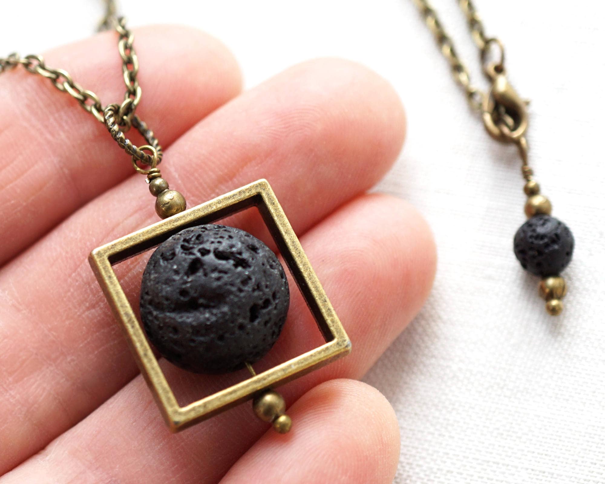 Essential oil necklace diffuser with lava stone