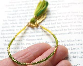 ON VACATION, Yellow Green Tassel Bracelet Thin Gold Beaded Angel Wing Charm Friendship Bracelet Tiny Seed Bead Bracelet Minimal