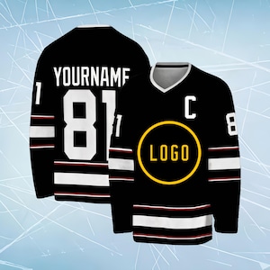 May include: A black hockey jersey featuring white and red stripes on the sleeves and hem. The front displays a yellow circular logo and the letter C, while the back shows the text YOURNAME above the large white number 81 and the number 1.