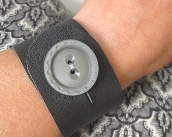 Black leather cuff bracelet modern hip - plastic grey button - handmade - own design - metal free - no metal - upcycling - for him - for her