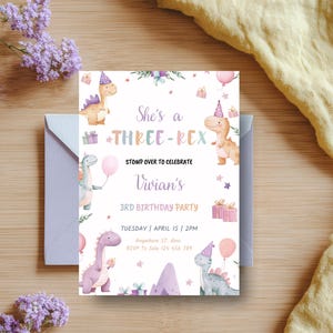 May include: A birthday party invitation with a dinosaur theme. The invitation features the text "She's a THREE-REX" and "Vivian's 3rd Birthday Party". The design includes illustrations of dinosaurs, balloons, and gifts, with a light purple envelope.