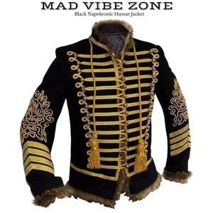 May include: Black Napoleonic Hussar jacket with gold trim and accents. The jacket features gold braid, tassels, and decorative embroidery on the sleeves. The collar and cuffs have a faux fur trim. The text "MAD VIBE ZONE" is at the top.