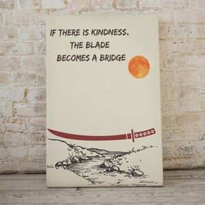 May include: Canvas art print featuring a red katana blade and a full orange moon. The artwork includes the text "IF THERE IS KINDNESS, THE BLADE BECOMES A BRIDGE" in black font. The art has a minimalist style.