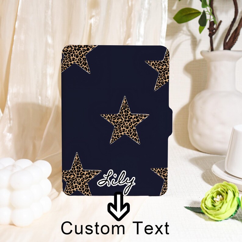 May include: A navy blue case with a leopard print star pattern. The case has a custom text option with the name "Lily" and the words "Custom Text" below. The case is rectangular with rounded corners.