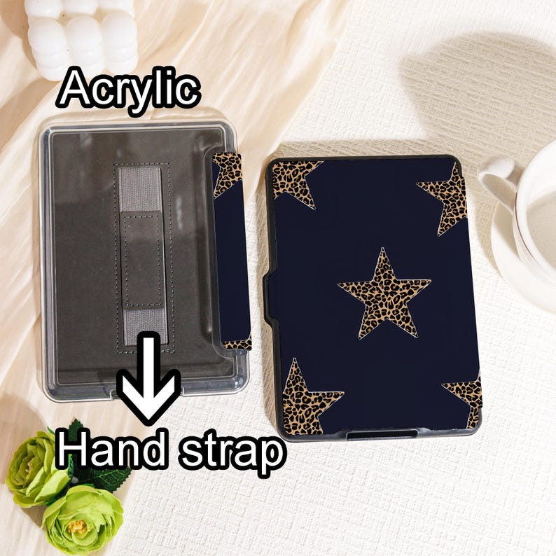 May include: A navy blue acrylic tablet case with a leopard print star pattern. The case has a hand strap and is designed to protect the tablet. The word "Acrylic" is printed on the case.