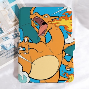May include: A tablet case featuring a vibrant illustration of Charizard, a popular fire-breathing Pokémon. The design showcases the character in shades of orange, yellow, and blue, with flames and dynamic poses. The case has a teal background.