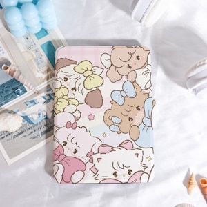 May include: A pink tablet case with a repeating pattern of cartoon animals wearing bows. The animals are in pink, brown, and white, with blue, yellow, and pink bows. The case has a soft, pastel aesthetic.
