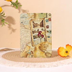 May include: A decorative travel-themed tablet case featuring a vintage map design with a globe, postcards, and stamps. The case has a beige background and includes the text "CIRCUS" and "WELCOME CIRCUS".