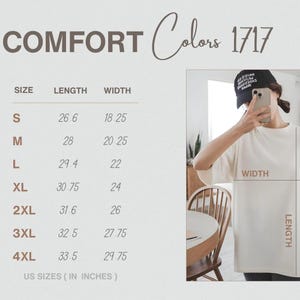 May include: Cream-coloured t-shirt with the text "COMFORT Colors 1717". The image includes a size chart with measurements in inches for sizes S through 4XL. A person is wearing the t-shirt.