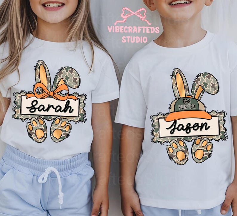 May include: White t-shirts with Easter-themed graphics. One shirt features a bunny with a bow and the name "Sarah". The other shirt has a bunny with a hat and the name "Jason". Both shirts have paw prints.