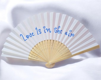 Personalized wooden and paper fan with embossed writing