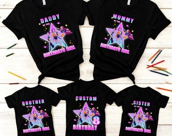 May include: Black t-shirts with a star graphic and text for a birthday celebration. The shirts read "Daddy of the Birthday Girl," "Mommy of the Birthday Girl," "Brother of the Birthday Girl," "Custom 8 Birthday," and "Sister of the Birthday Girl."