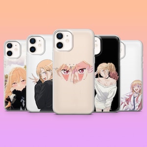 May include: A collection of five phone cases featuring anime-style illustrations. The cases showcase various characters with blonde hair and expressive eyes. The cases are in different colors, including white and black, with the illustrations in vibrant colors.