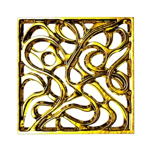May include: A gold-colored metal square with a decorative design of intricate swirls and curves.
