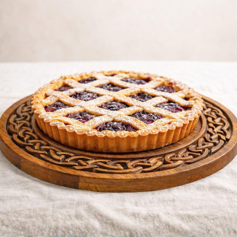 Round wooden tray with Celtic knot border relief, shown with cake, decorative CNC carving design.