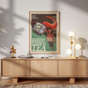 Peut inclure: Une affiche encadrée intitulée WONDERFUL TEA présentant une illustration graphique d'une personne tendant la main vers une tasse de thé flottante avec un liquide rouge tourbillonnant, un fond sombre et du texte blanc.
