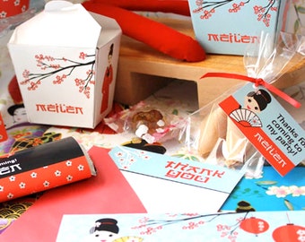 May include: A set of party favors for a Japanese-themed birthday party. The favors include a small red and white box with a cherry blossom design, a small bag of fortune cookies, and a thank you tag with a cartoon geisha girl. The tag says "Thanks for coming to my party! Meilen".