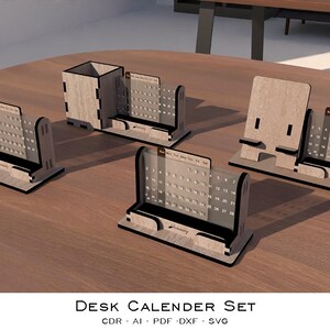 May include: A set of wooden desk organizers and calendars. The set includes pen holders, phone stands, and calendars with a minimalist design. The items are made of light-colored wood with black accents. The text "Desk Calendar Set" is visible.