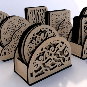 May include: Set of six wooden coasters with intricate laser-cut designs. The coasters are arranged in a stand with a half-circle shape. The stand is also made of wood and has a black border.