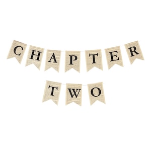May include: A decorative banner spelling out "CHAPTER TWO". The pennants are printed with black letters on a vintage newspaper-style background. The pennants are strung together with a thin white string, set against a white backdrop.