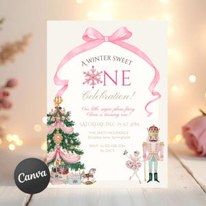 May include: A rectangular invitation card featuring a pink ribbon bow at the top, a decorated Christmas tree, a ballerina, and a nutcracker. Text reads: A WINTER SWEET ONE Celebration! Our little sugar plum fairy Olivia is turning one! SATURDAY, DEC 19 AT 3PM.