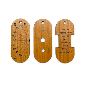 May include: Three wooden yarn gauge tools. The first has a fan-like design with numbers and the letters "S" and "Z". The second has three holes. The third has text indicating yarn weights, including "lace", "fingering", "sport", "dk", "worsted", "aran", "bulky", and "super bulky".