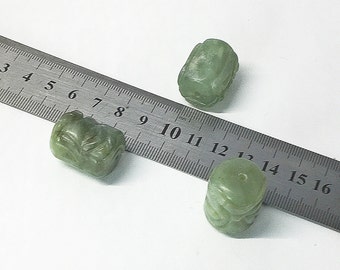 Carved green serpentine beads