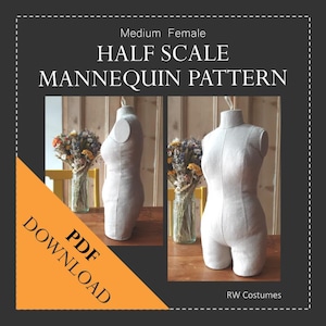 May include: A PDF download pattern for a half-scale female mannequin. The pattern is for a medium size mannequin. The image shows two mannequins made from the pattern, one from the front and one from the side. The mannequins are made of a light-colored fabric. The image also includes text that says "Half Scale Mannequin Pattern" and "PDF Download".