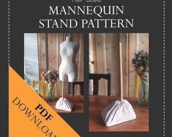 May include: A PDF download pattern for a half-scale mannequin stand. The image shows a finished stand with a fabric-covered base and a wooden dowel. The text "PDF DOWNLOAD" is in a yellow triangle.