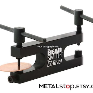 May include: A black metal Bead Smith EZ-Rivet tool featuring two T-shaped handles for manual operation. The device is positioned with a circular copper disc between the jaws. The text "Your paragraph text" and "the BEAD SMITH EZ-Rivet" are printed on the side.