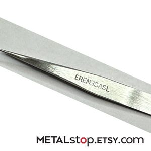 May include: A handmade, wooden cutting board with a natural finish. The rectangular board features a juice groove and a handle. Dimensions are approximately 18 inches long, 12 inches wide, and 1 inch thick.